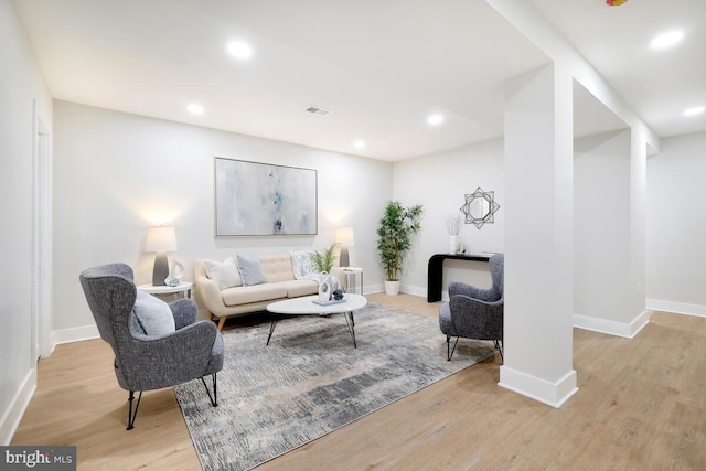 living room with light hardwood / wood-style flooring