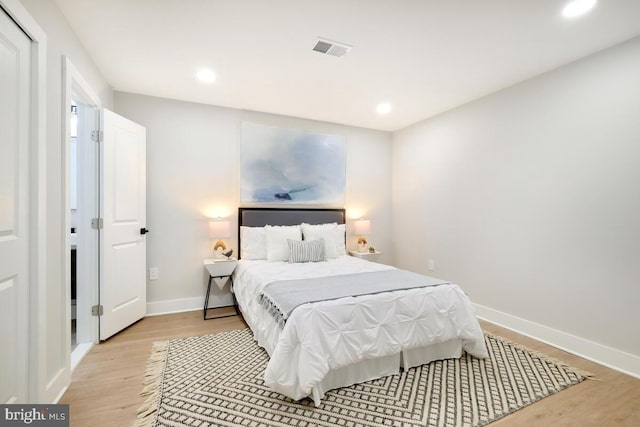 bedroom with light hardwood / wood-style flooring