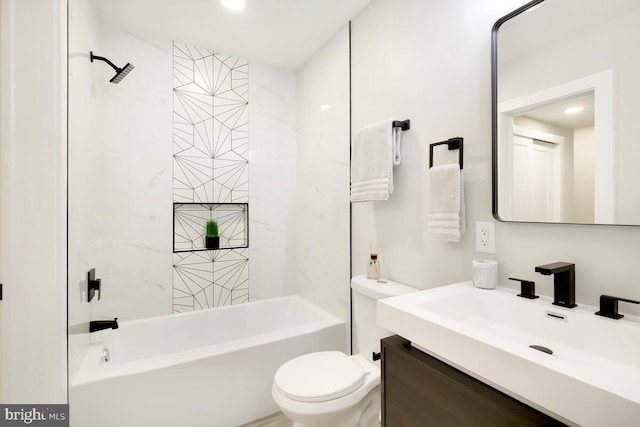 full bathroom with vanity, toilet, and tiled shower / bath