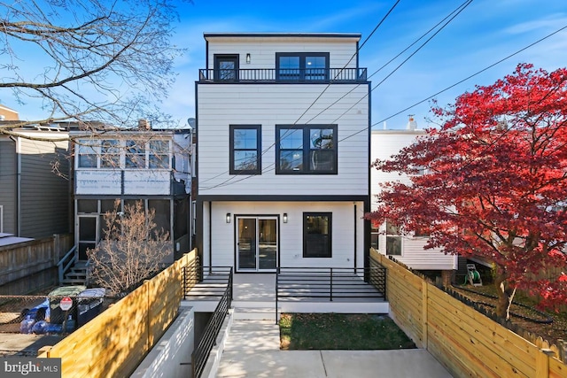 view of front of home with a balcony