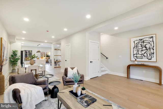 living room with light hardwood / wood-style floors