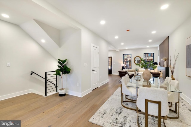 dining area with light hardwood / wood-style floors