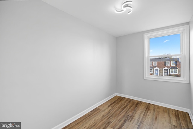 spare room with hardwood / wood-style floors