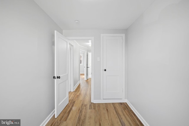 hall with light hardwood / wood-style floors