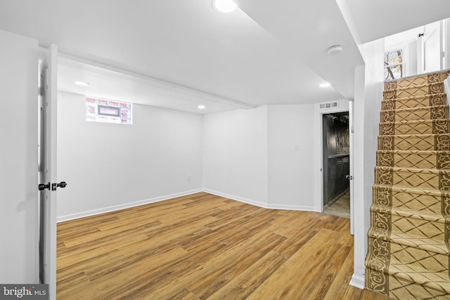 basement featuring wood-type flooring