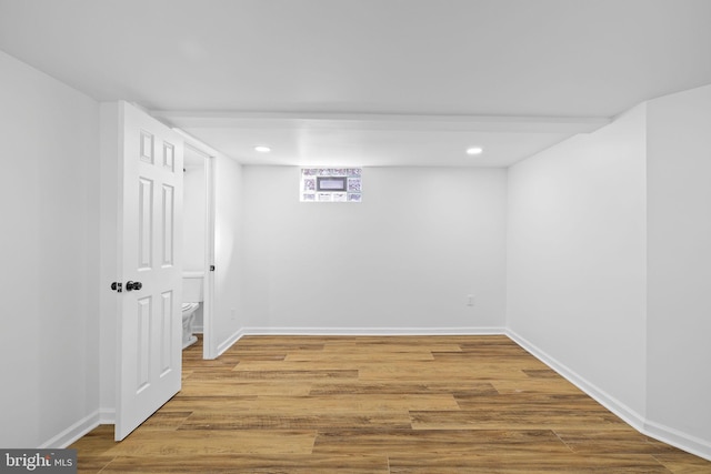 basement featuring wood-type flooring