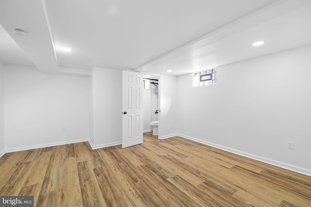 basement featuring light hardwood / wood-style floors