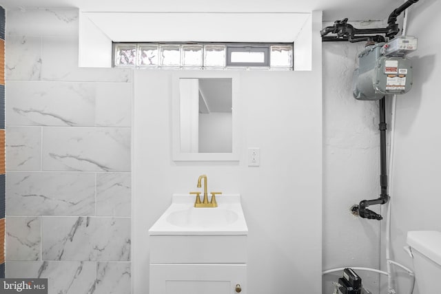 bathroom featuring vanity and toilet