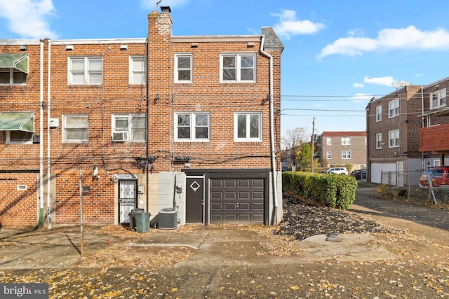 back of property with central AC unit