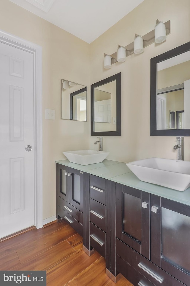 bathroom featuring hardwood / wood-style floors and vanity