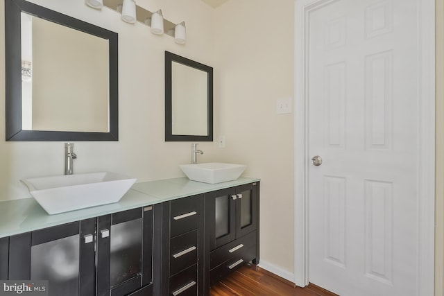 bathroom featuring vanity and wood-type flooring