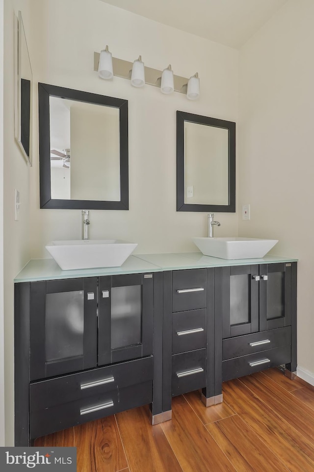 bathroom featuring vanity, hardwood / wood-style flooring, and ceiling fan