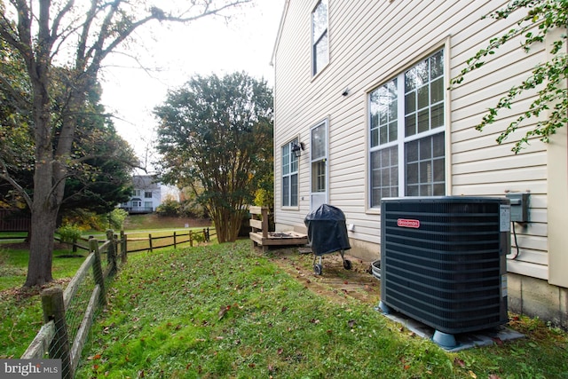 view of yard featuring central air condition unit