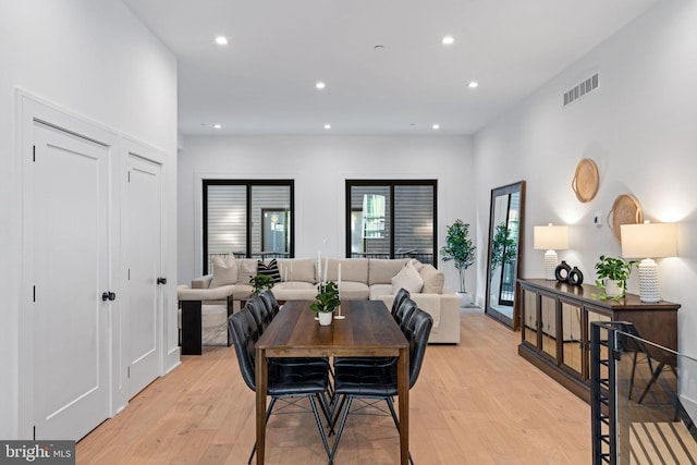 dining space with light hardwood / wood-style floors