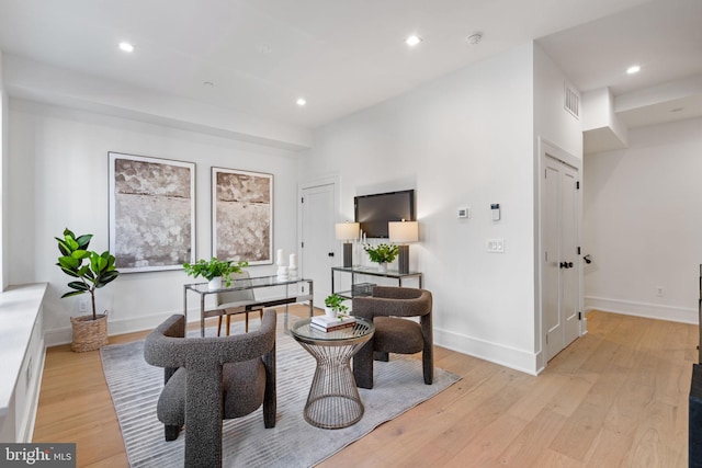 living area with light hardwood / wood-style floors