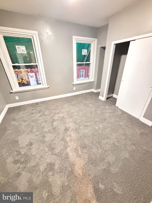 unfurnished bedroom with carpet flooring