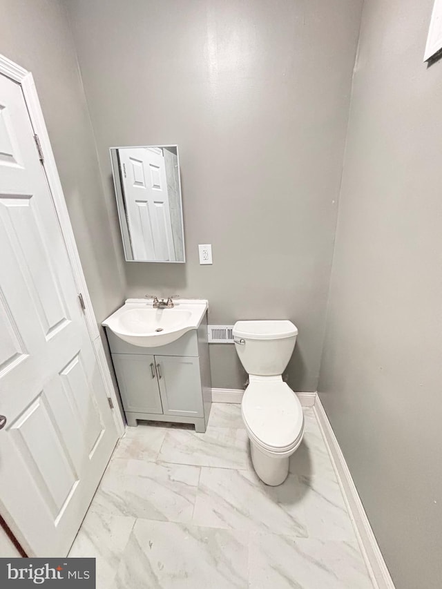 bathroom with vanity and toilet