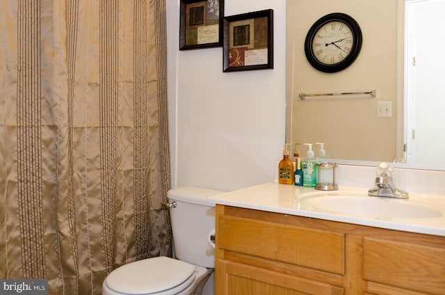 bathroom with vanity and toilet