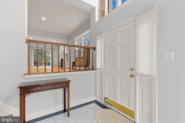 foyer entrance featuring light tile patterned floors