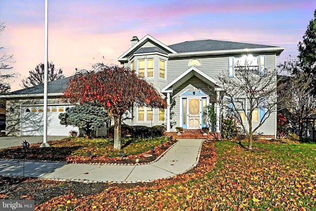 view of front of home with a garage