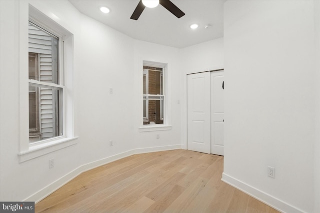 unfurnished room featuring ceiling fan and light hardwood / wood-style flooring