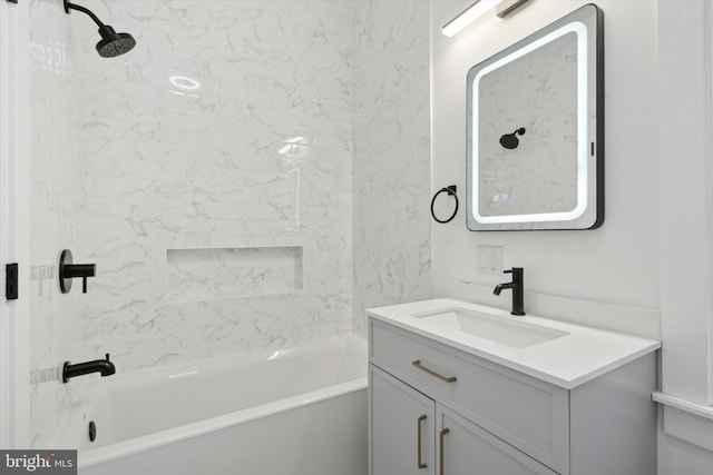 bathroom featuring vanity and tiled shower / bath combo