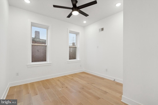 spare room featuring ceiling fan and light hardwood / wood-style flooring