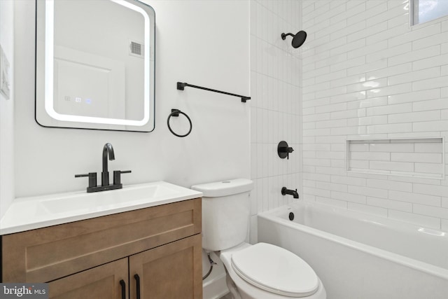 full bathroom with vanity, toilet, and tiled shower / bath