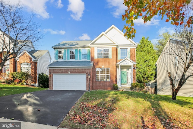 view of front facade with a front yard and a garage