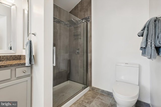 bathroom with vanity, toilet, and walk in shower