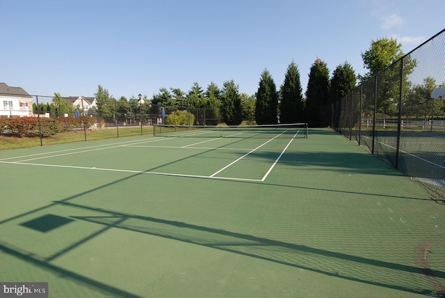 view of sport court with basketball hoop