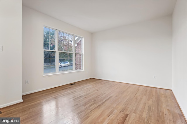 spare room with light wood-type flooring