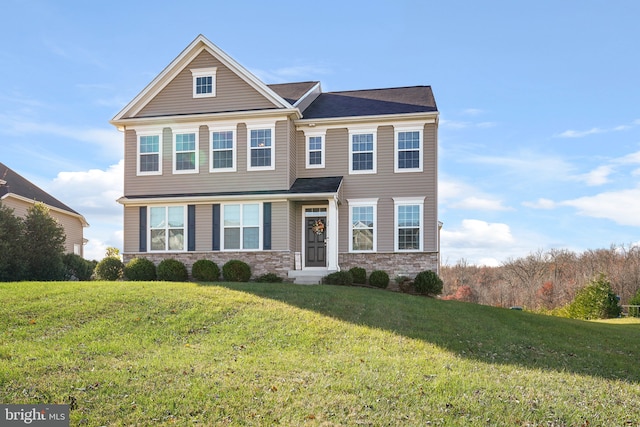 view of front of home with a front yard