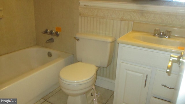 bathroom with vanity, tile patterned flooring, a bathtub, and toilet