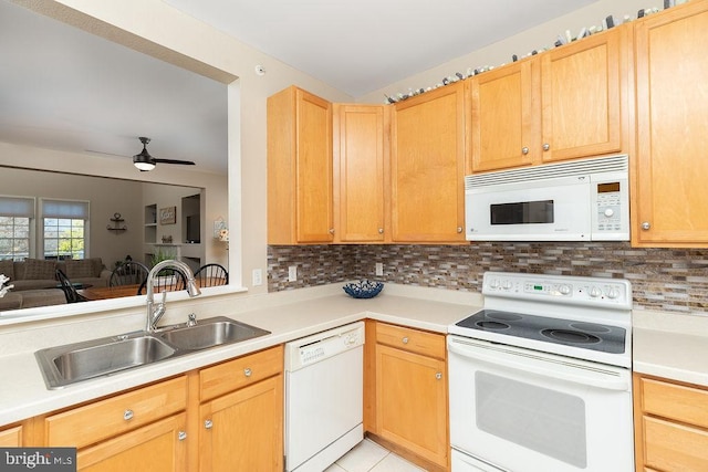 kitchen featuring ceiling fan, sink, white appliances, decorative backsplash, and light brown cabinetry