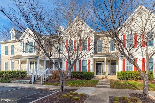 54 October Glory Ave Unit 54F, Ocean View, DE 19970 - townhome / multi-family property with uncovered parking and a porch