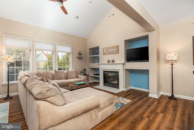 living room featuring dark hardwood / wood-style floors, ceiling fan, built in features, and high vaulted ceiling