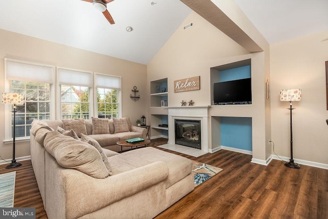 54 October Glory Ave Unit 54F, Ocean View, DE 19970 - living area with baseboards, built in shelves, wood finished floors, high vaulted ceiling, and a fireplace with flush hearth