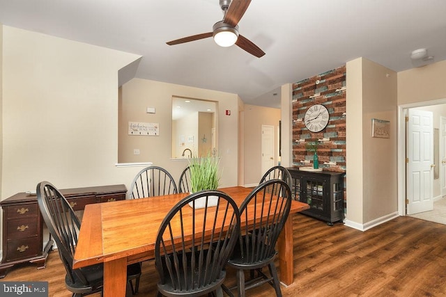 dining room with ceiling fan and wood-type flooring