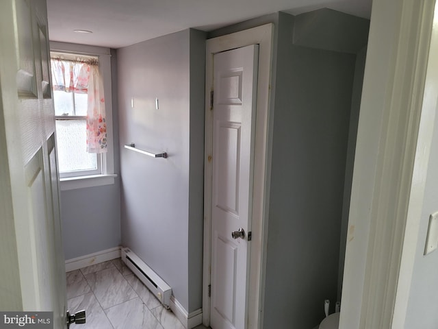 bathroom with a baseboard radiator