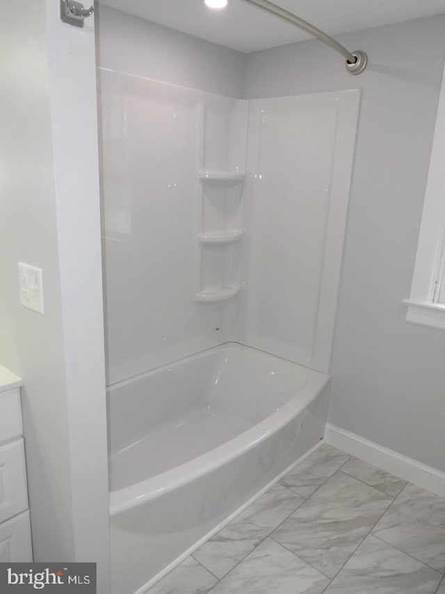 bathroom with vanity and bathing tub / shower combination