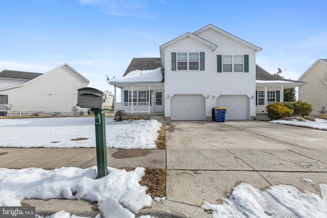 view of front of property with covered porch and a garage