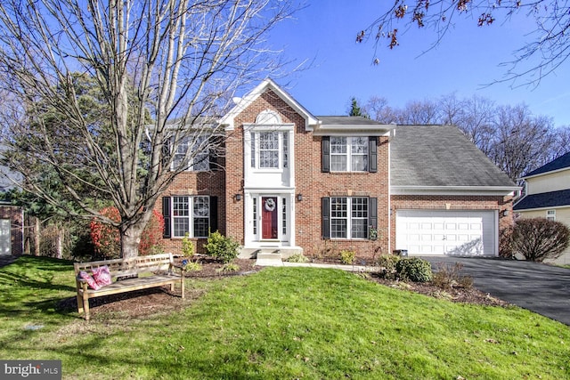 colonial-style house with a front yard