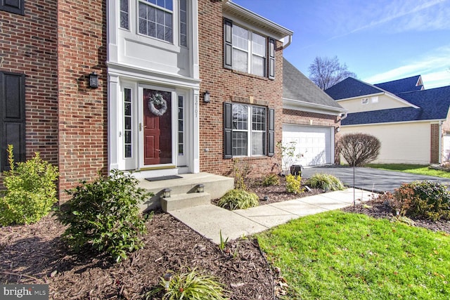 doorway to property featuring a garage