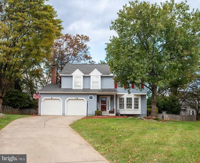 view of front facade with a front yard and a garage