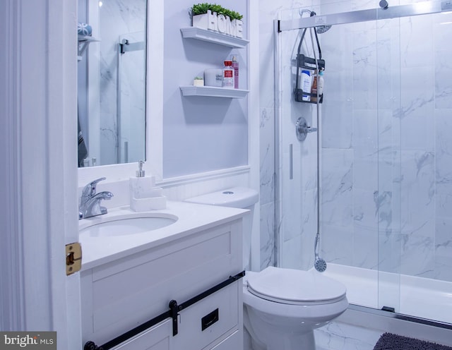 bathroom with walk in shower, vanity, and toilet