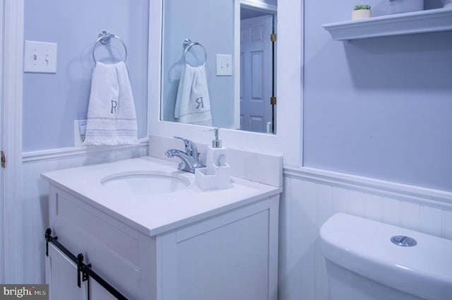 bathroom with vanity and toilet