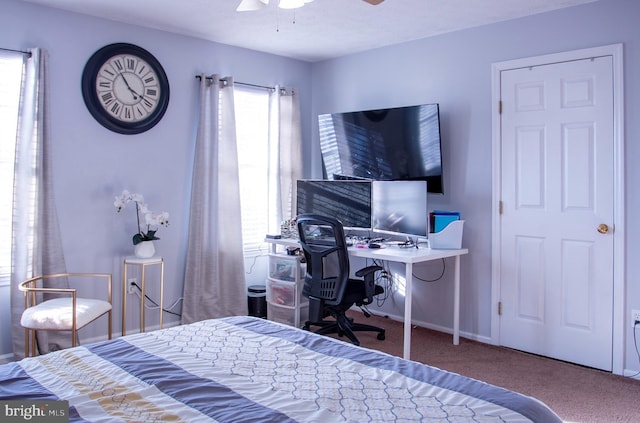 carpeted bedroom with ceiling fan