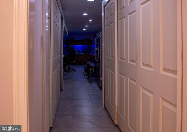 corridor featuring light tile patterned floors