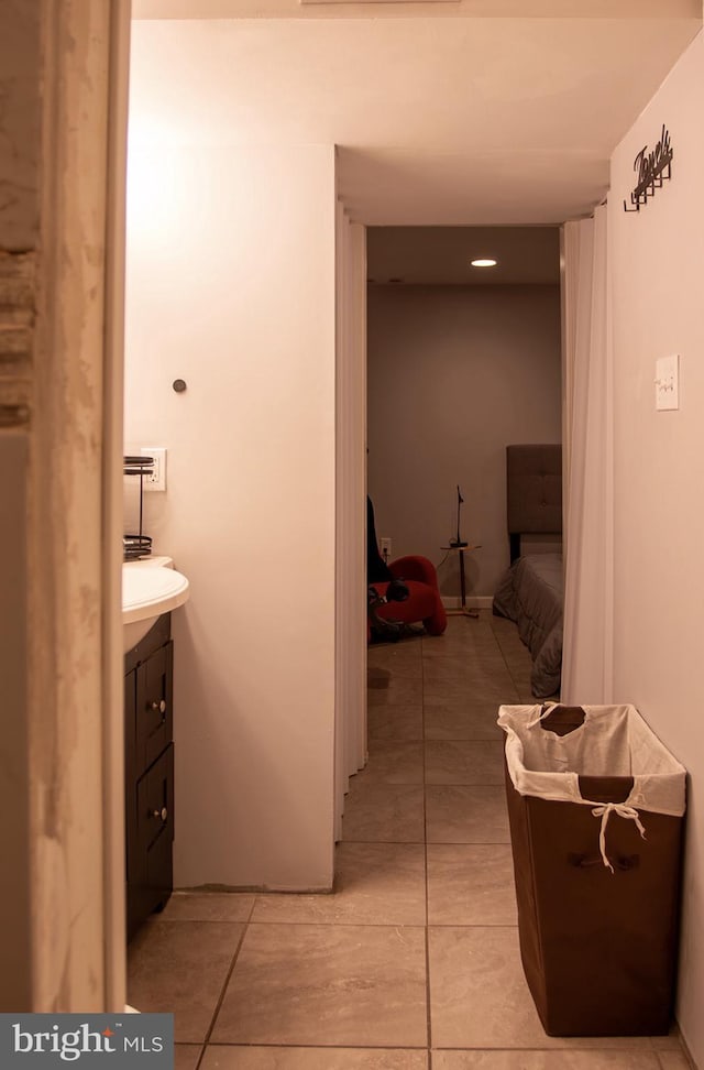 bathroom with tile patterned flooring and vanity